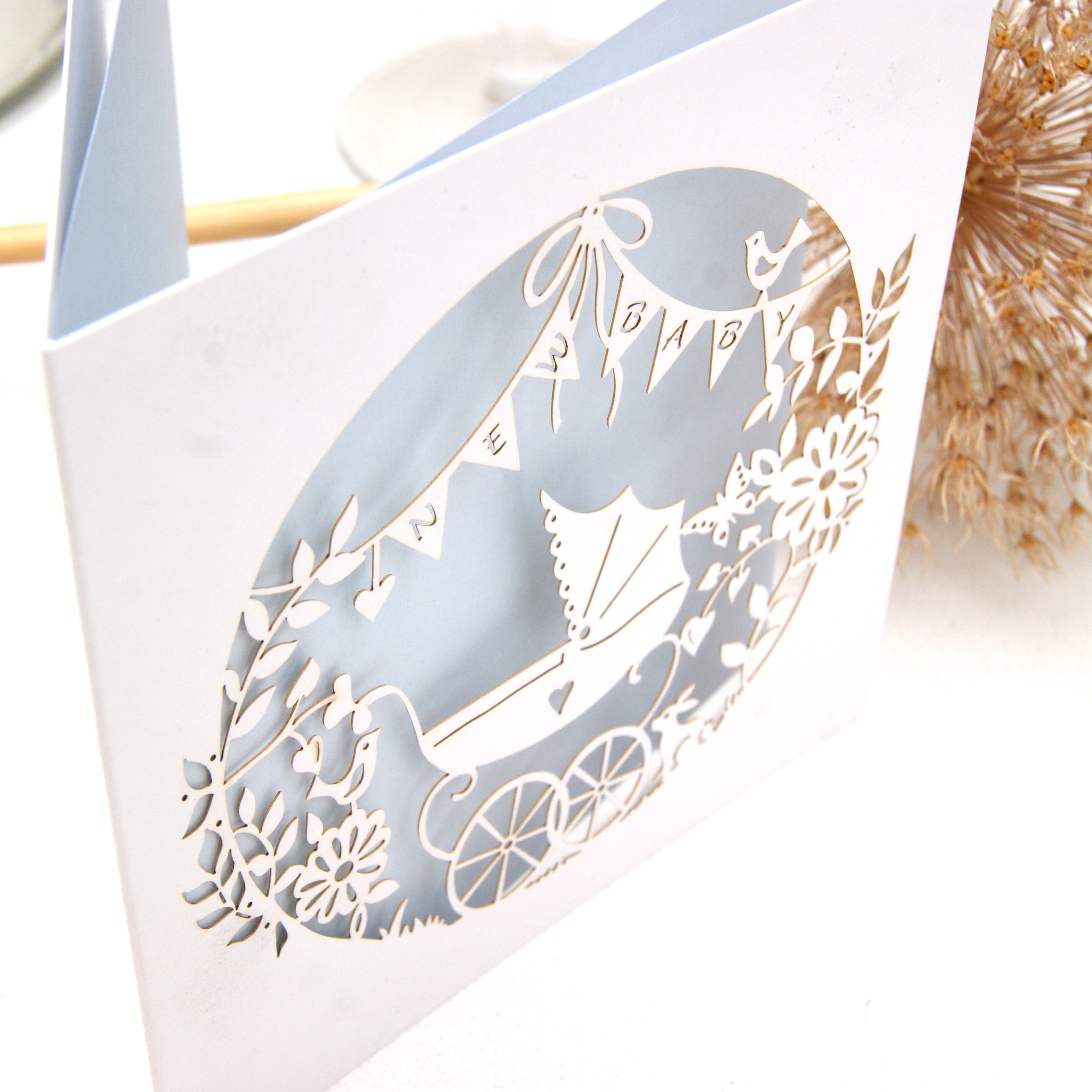Laser cut new baby card in blue